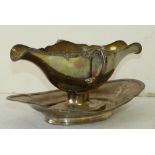 A Continental Silver Coloured Metal 2-Handled Double Spouted Gravy Boat on fixed saucer,
