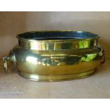 A 19th Century Brass Oblong Bulbous Shape Wine Bucket having drop ring handles,