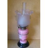 Hinks's Duplex Pink China Paraffin Lamp with glass shade and chimney on sweeping base,