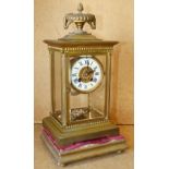 A Gilt Metal 8 Day Striking Mantle Clock with mercury pendulum,