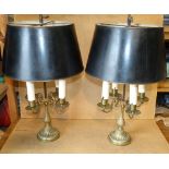 A Pair of Gilt Metal 4 Light Table Lamps having rise and fall black shades,