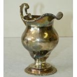 An Early George III 18th Century Silver Bulbous Cream Jug having fluted rim,