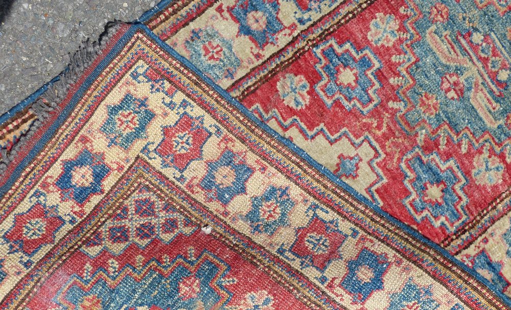 A Small Persian Rug on white, red and blue ground having 3 centre medallions, - Image 2 of 2