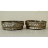 A Pair of George III Silver Wine Coasters having embossed key pattern, grape and vine decoration,