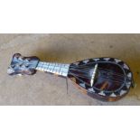 A Tortoiseshell and Mother of Pearl Miniature Mandolin, 11.