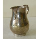 A London Silver Plain Bulbous Shape Cream Jug having scroll handle, makers mark C.S&HS 3.