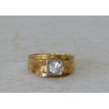 An 18ct Gold Continental Ring set with clear stones, overall weight 10.