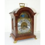 A Reproduction Walnut 8-Day Striking Bracket Clock having arched dial,