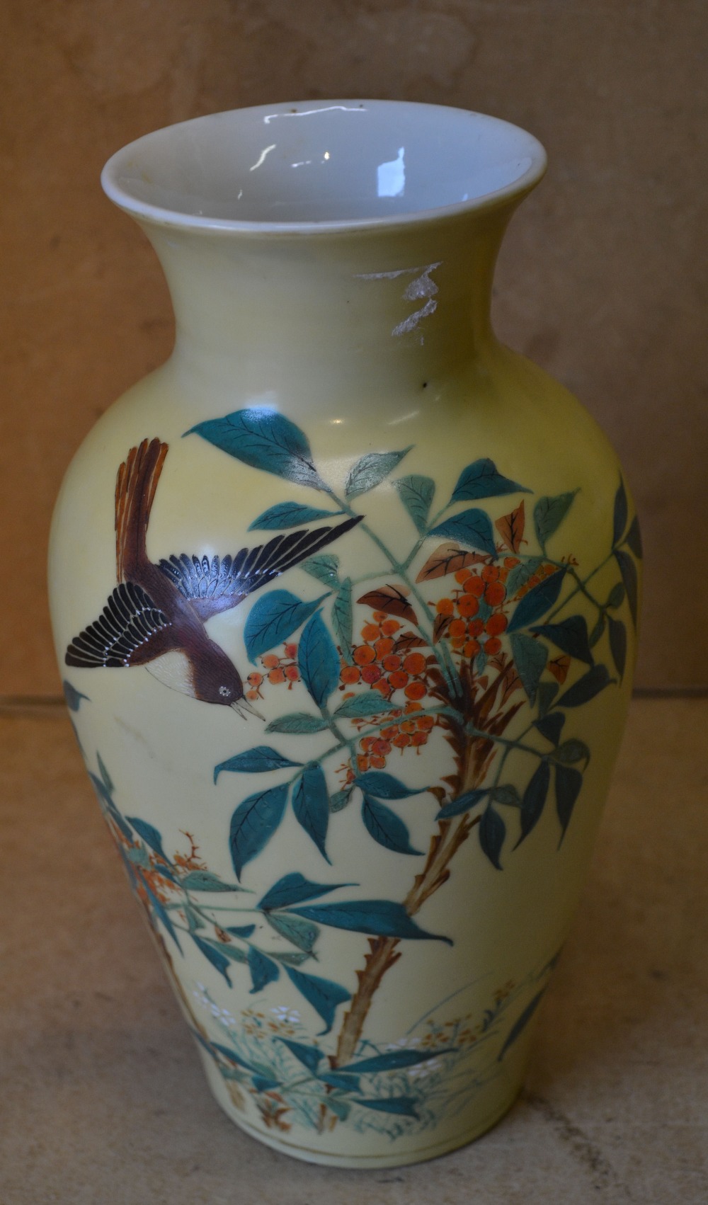 A China Bulbous Trumpet Shape Vase on yellow ground with multicoloured bird,