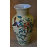 A China Bulbous Trumpet Shape Vase on yellow ground with multicoloured bird,