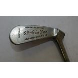 A "Whole in One" Adjustable Golf Club with original grip,