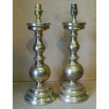 A Pair of Brass Bulbous Shape Table Lamps on round sweeping bases,