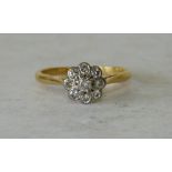 An 18ct Gold Ladies Cluster Ring set with diamonds