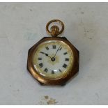 A 9ct Gold Octagonal Shape Fob Watch having white enamel dial with Roman numerals,
