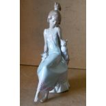 A Lladro Figure a young seated girl with cats,