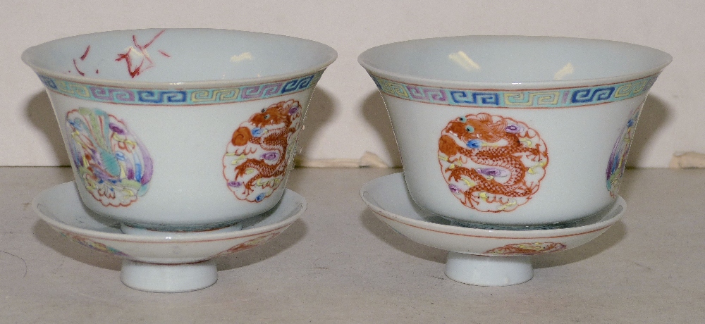 A Pair of Oriental Round Trumpet Shape Bowls with covers on white ground having multicoloured