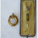 An 18ct Gold Pendant Compass having serpent motifs (glass to 1 side a/f) also a gold tie pin