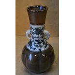 An Oriental Bulbous Thin Necked Trumpet Shape 2-Handled Vase on brown,