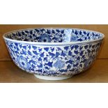 A Reproduction Oriental Round Punch Bowl on blue and white ground with floral,