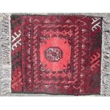 A Small Persian Prayer Rug on red ground having centre medallion,