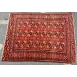 A Persian Rug on red ground having 3 x 8 centre medallions,