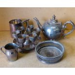 A Set of 6 Silver Plated Egg Cups on round stand having centre carrying handle on claw and ball