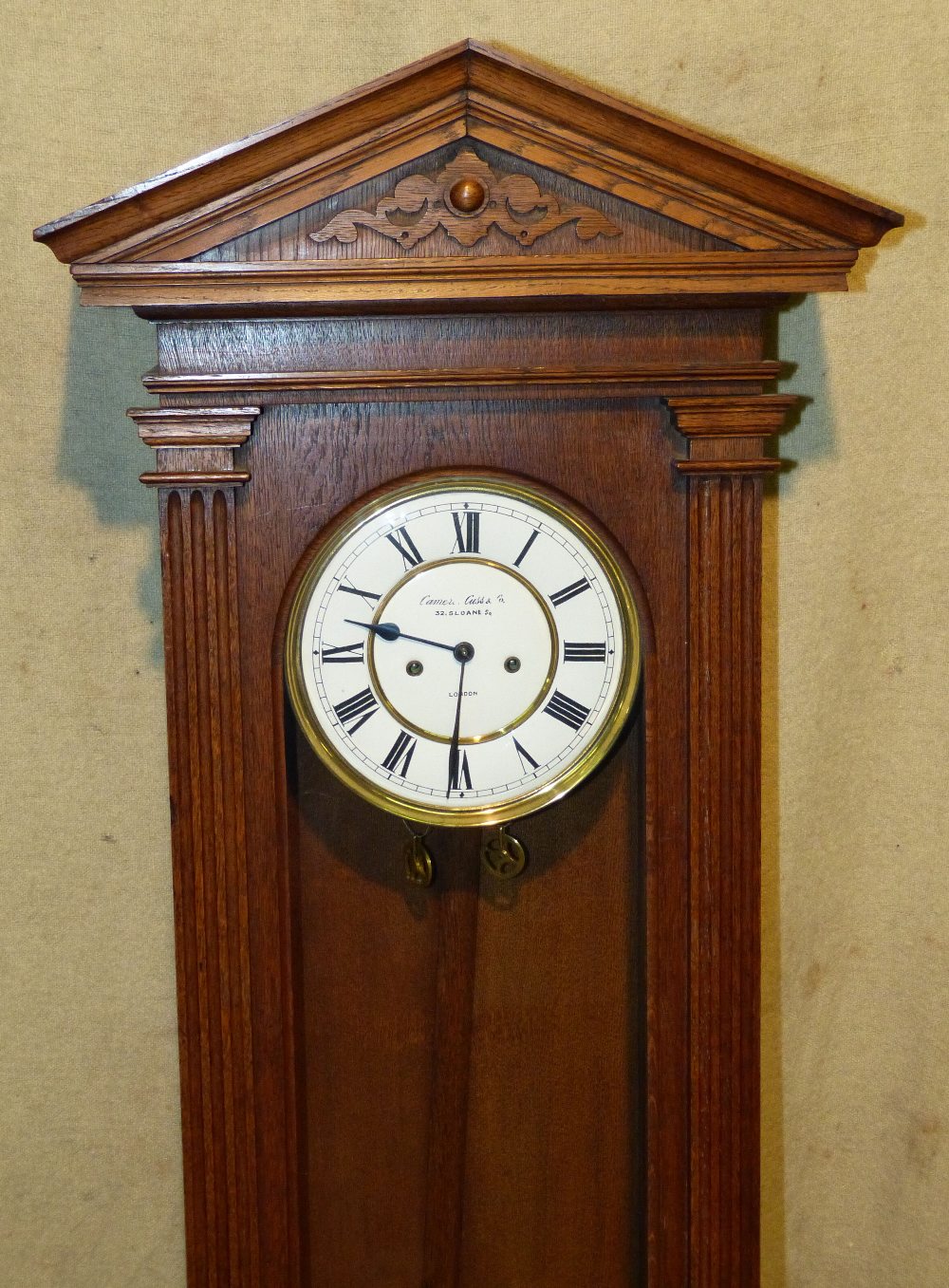 Camerer Cuss & Co London  Vienna  8 Day Striking Wall Clock having reeded column supports oval