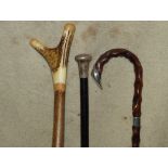 An Ebonised Walking Cane having London silver knob handle,