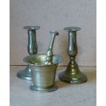 A Pair of Brass Candlestick on turned stems having oval sweeping bases. 14.