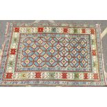 A Persian Carpet on blue, red, cream and green ground having various centre medallions,