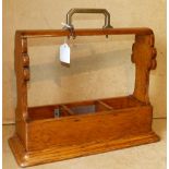 An Oak 3 Bottle Tantalus (no decanters) with key centre carrying handle,