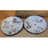 A Pair of 18th Century Oriental Round Scalloped Dishes on white ground with multicoloured floral,