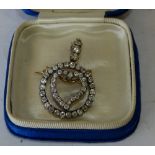 A Victorian Circular drop Pendant/Brooch mounted with inner heart motif,