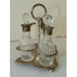 A Victorian Scottish Silver Cruet Set having centre ring handle on ball feet,