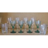A Set of 4 Green Trumpet Shape Wine Glasses having engraved grape and vine bowls on round bases,
