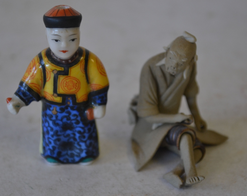 A China Snuff Bottle in form of a figure (no stopper) also a china figure of a seated oriental