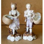 A Pair of Continental China Figures of young gentlemen and lady holding baskets,