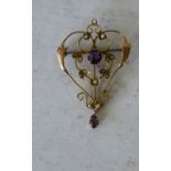 A 9ct Gold Drop Pendant/Brooch having pierced decoration set with 2 x amethysts and half pearls