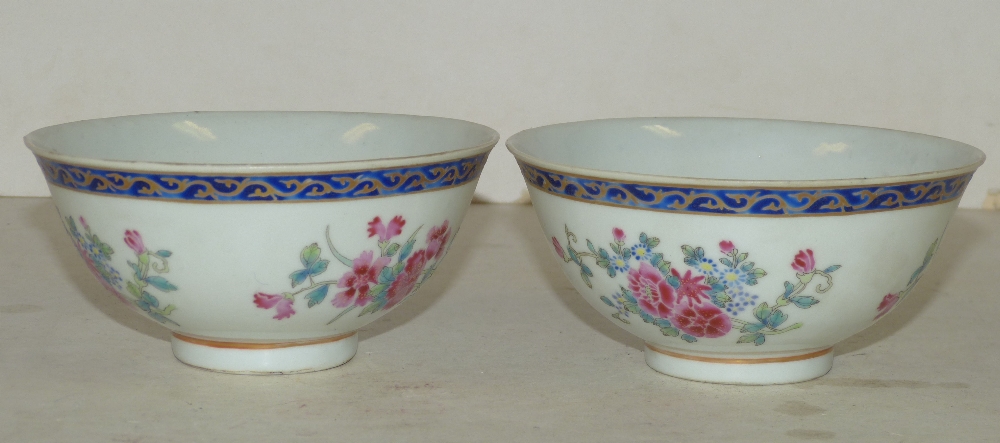 A Pair of Oriental Round Trumpet Shape Bowls on white and blue ground with multicoloured floral,