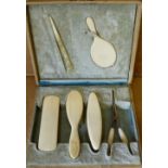 A Child's Ivory Mounted Manicure Set in fitted box