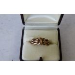 A 9ct Gold Ring having entwined decoration, 4.