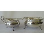 A Sheffield Silver Bulbous Sugar Bowl and matching cream jug having crinkled rims on splayed feet,