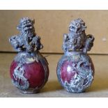 2 Oriental Paperweights in form of Dogs of Fo seated upon balls, 6.