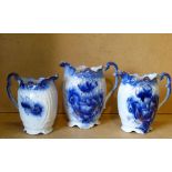 3 x Blue and White Oval Graduated Jugs having crinkled rims with floral and leaf decoration,