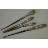 A Pair of Silver Handled Glove Stretchers and 2 silver handled button hooks (3)