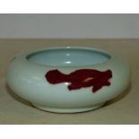 An Oriental Bulbous Shallow Brush Pot on white ground having red fish decoration,