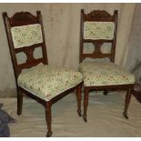 A Set of 4 Oak Single Chairs having floral overstuffed seat and part backs on round turned legs
