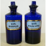 A Pair of 19th Century Bristol Blue Glass Medicine Bottles with stoppers, 23.