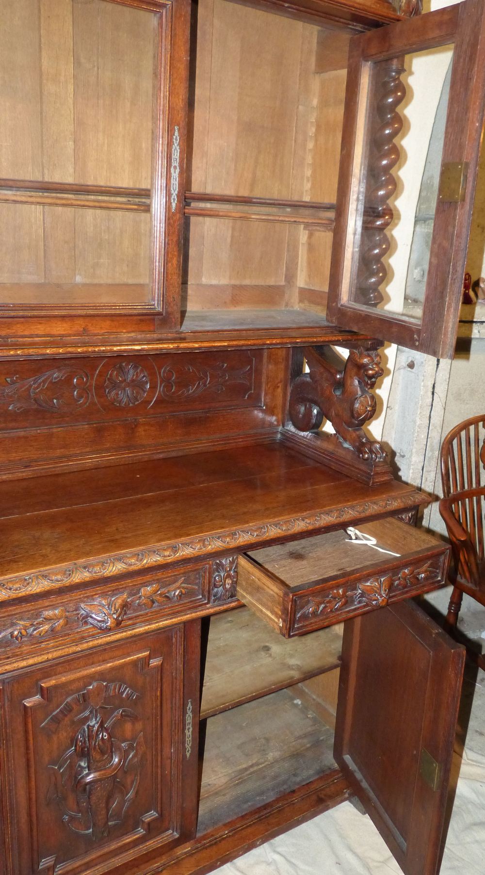 A Victorian Oak Bookcase having all over raised animal, shield, floral and scroll decoration, - Image 3 of 4
