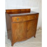 A Mahogany Bow Fronted Side Board having lipped back, banded top,
